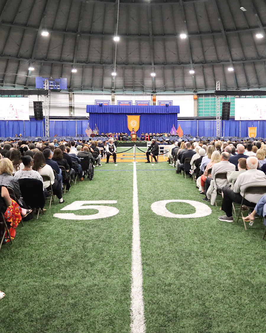 attendees at convocation facing the stage