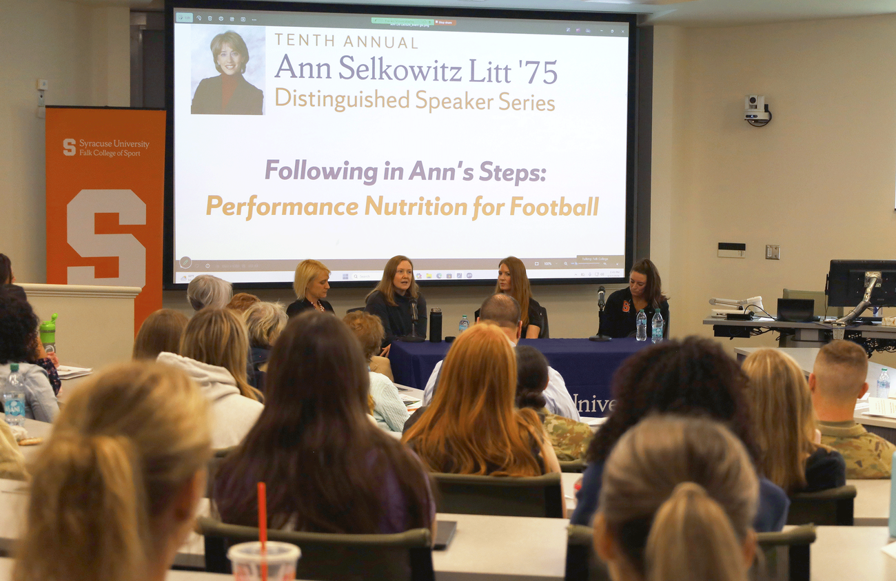 Ann Litt lecture with five female panelists and students in the audience
