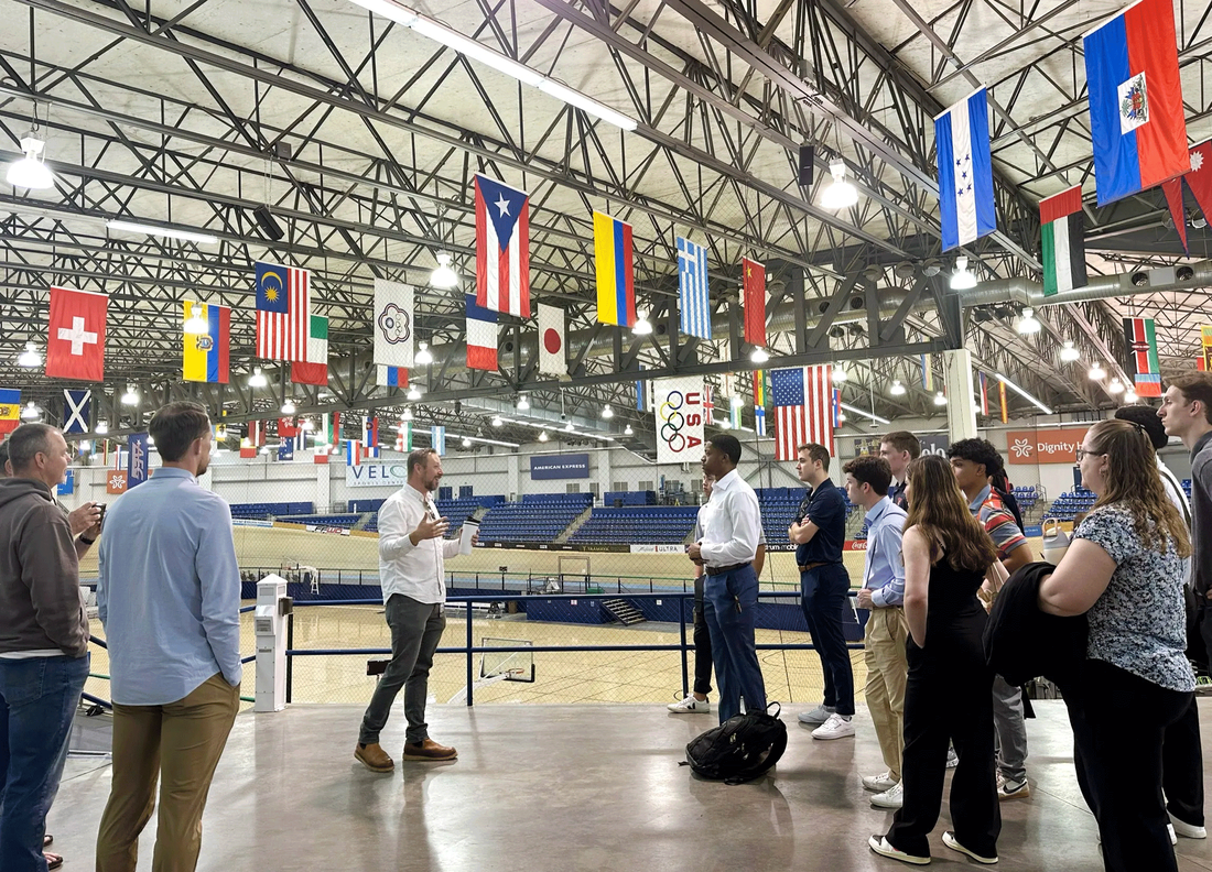 people wandering round floor of VELO sport center