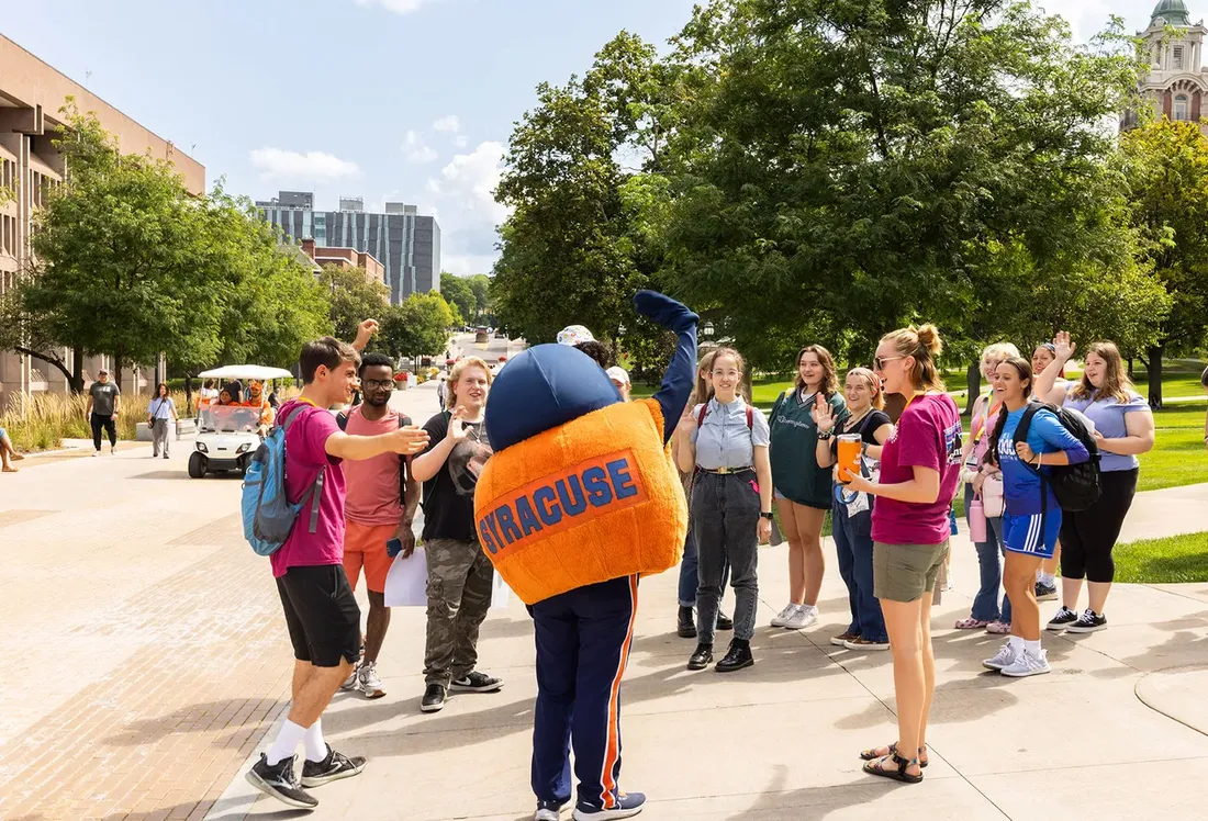 Otto talks with students on campus