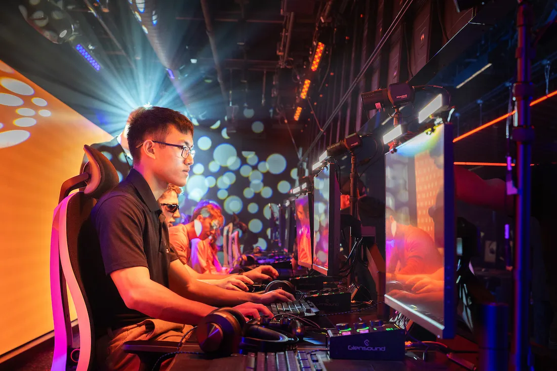 An esports student at a monitor