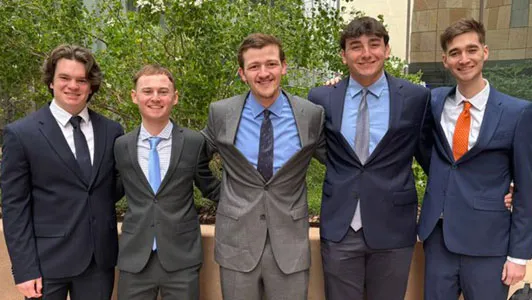 Five male students standing together who were part of the SABR Diamond Dollars Case Competition