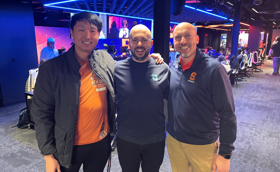 three men standing together convention center